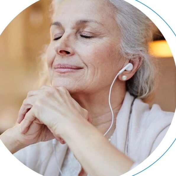 Woman listening to music with eyes closed.